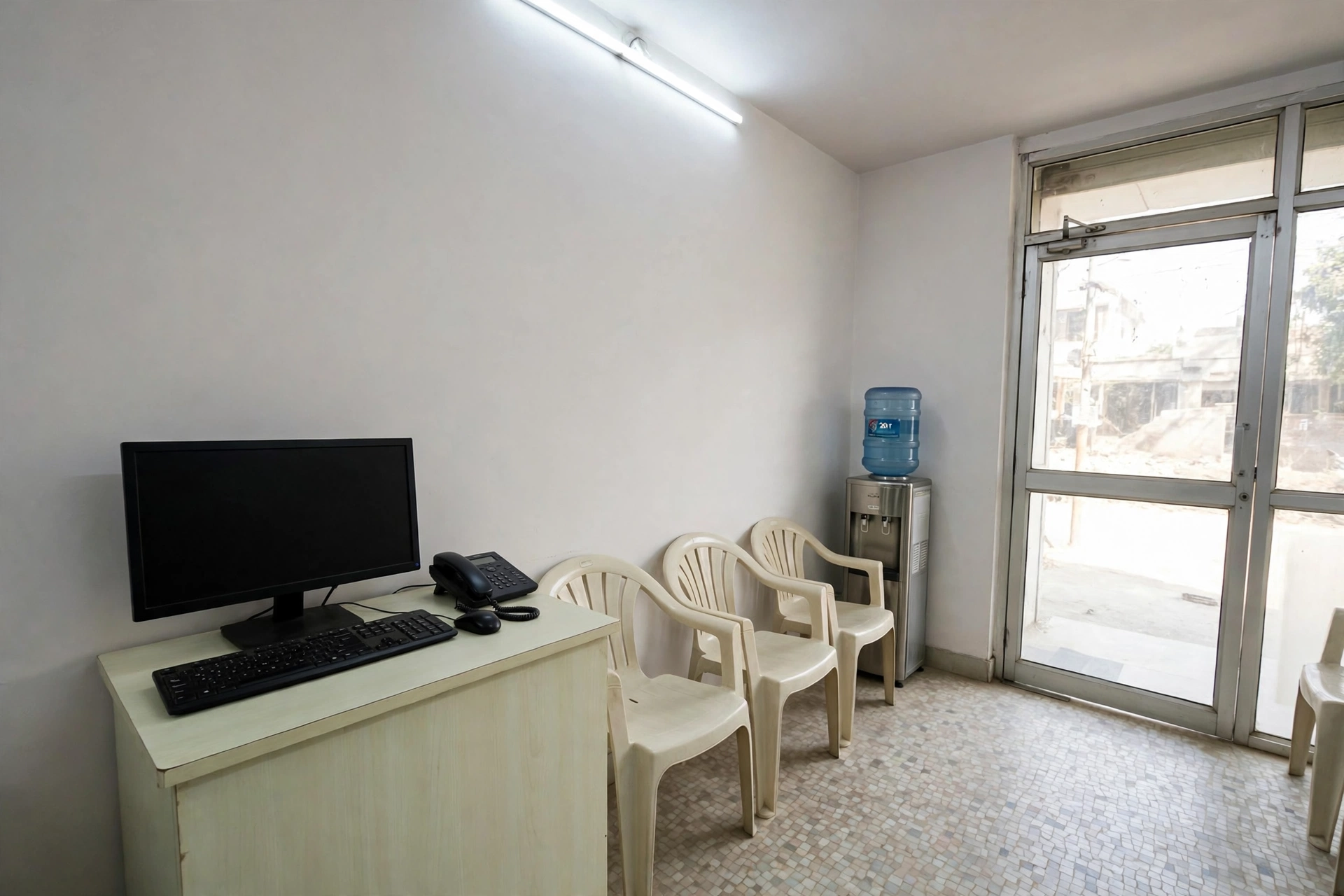 The reception desk and waiting chairs